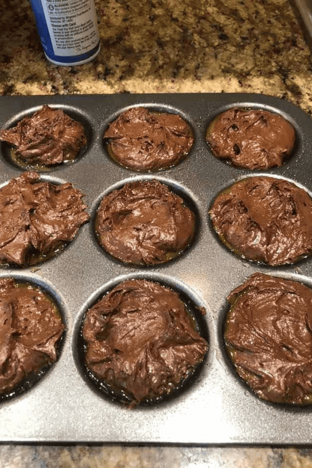 Whoopie pie pan inside the air fryer basket cooking at 320 degrees