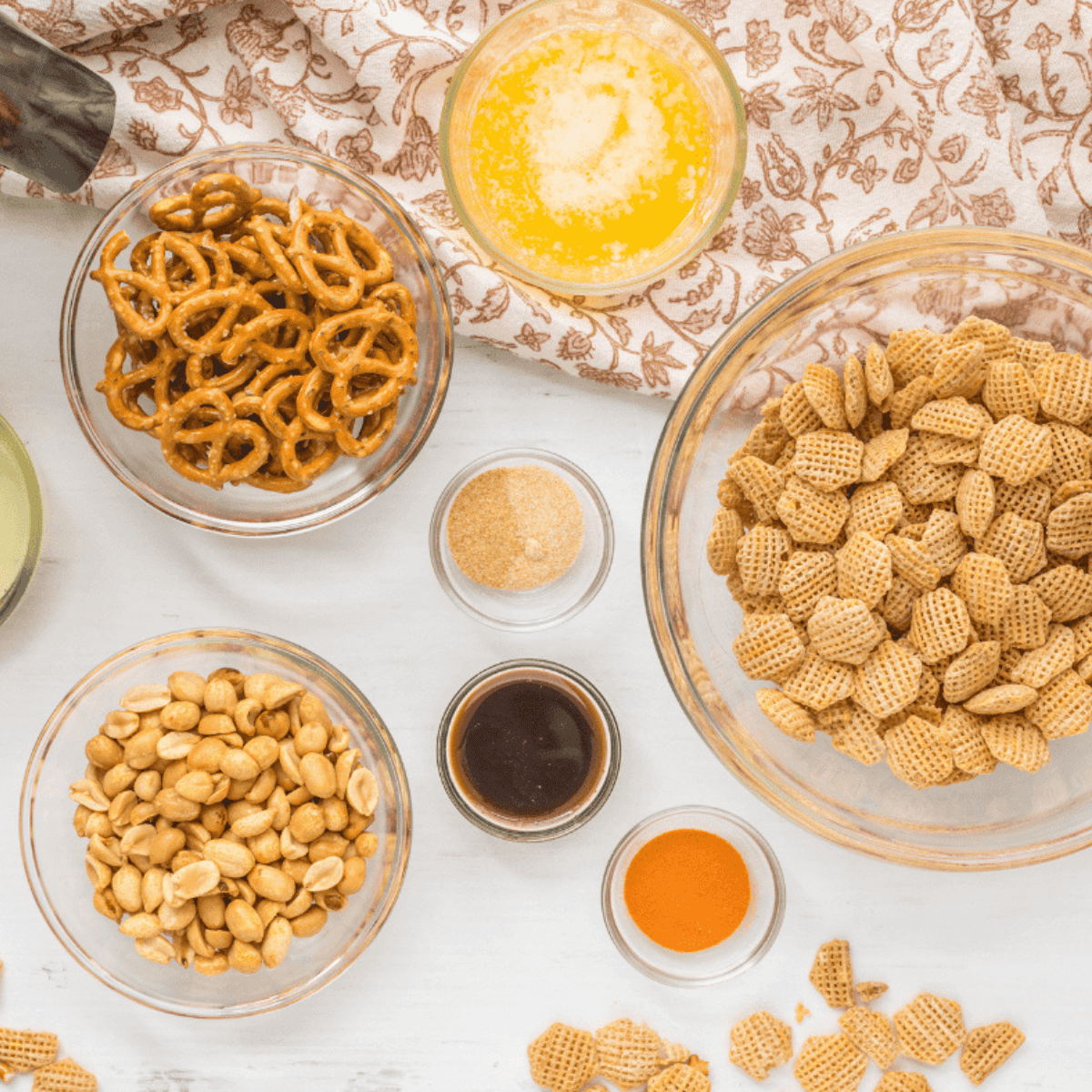Ingredients needed for Easy Air Fryer Chex Mix on kitchen table.