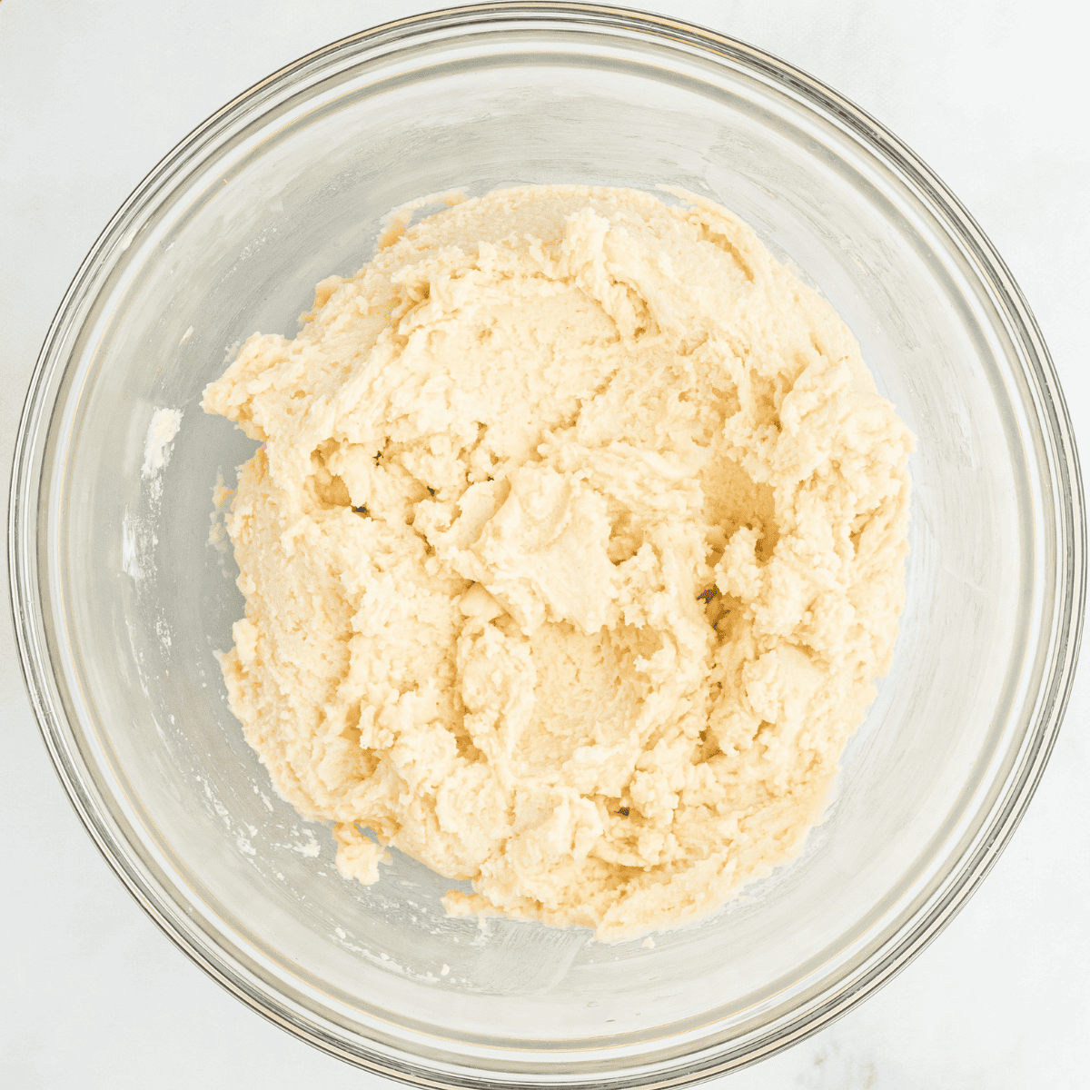 Mixing vegetable oil, sugar, vanilla, eggs, and anise in a large bowl until frothy.