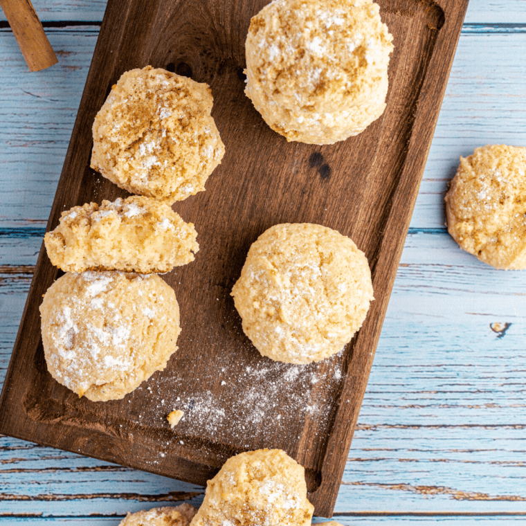 Freshly baked snickerdoodle cookies in the air fryer, golden brown with a cinnamon-sugar coating.