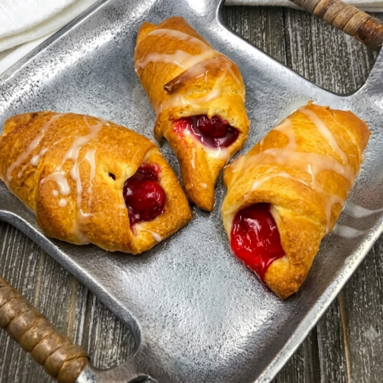 Air fryer cherry filled crescent rolls with golden flaky pastry and cherry filling inside