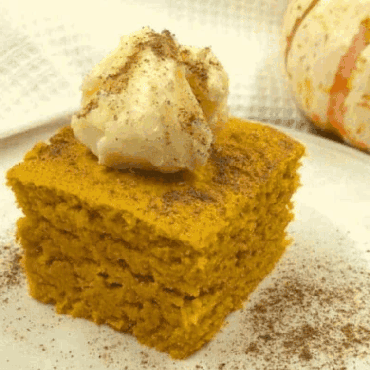 Slice of Easy Air Fryer Pumpkin Cornbread on a plate, golden brown with a soft, fluffy texture.