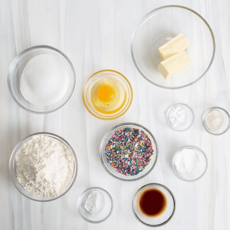 Ingredients needed for Easy Air Fryer Confetti Cookies on kitchen table.