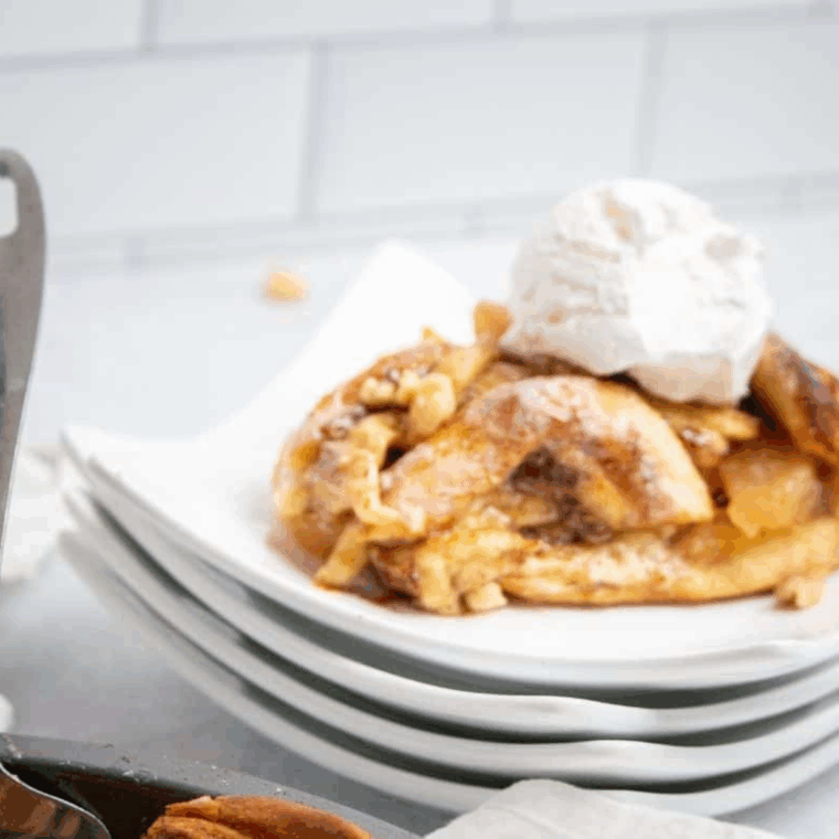 Close-up of cinnamon roll apple pie slice with spiced apples