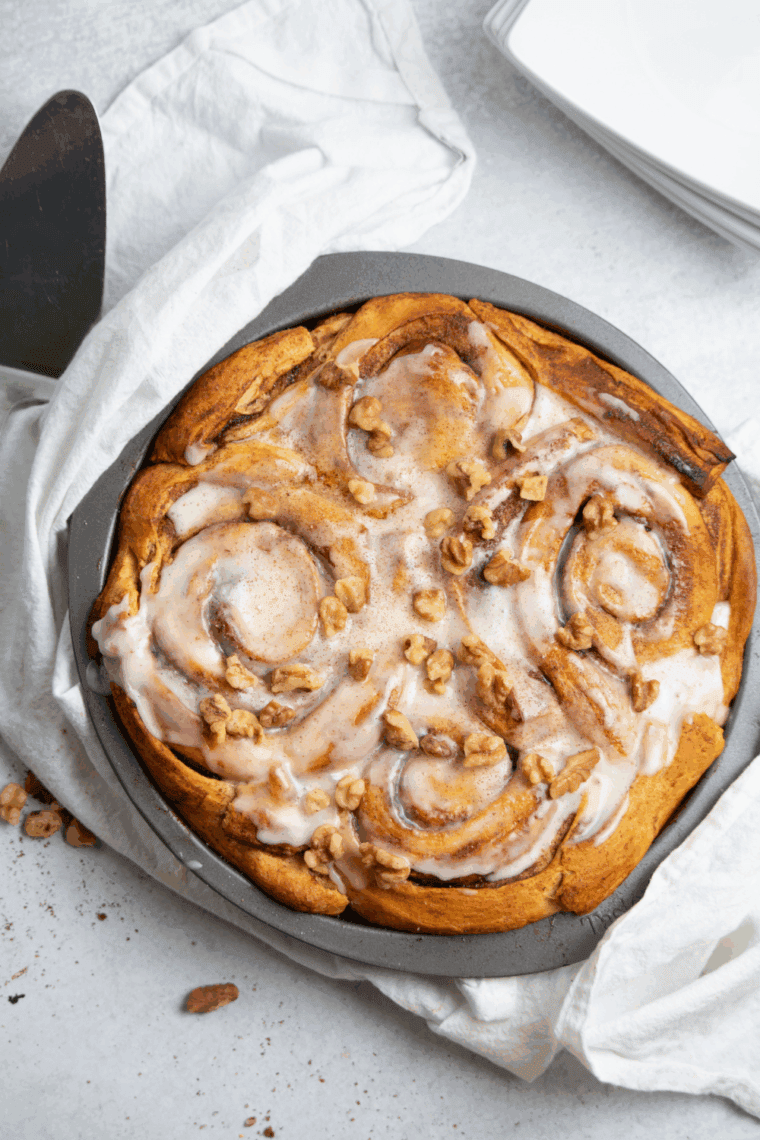 Slice of air fryer cinnamon roll apple pie on plate