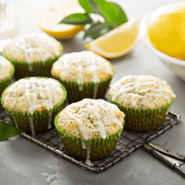 Golden, fluffy air fryer lemon poppy seed muffins with zesty lemon and sprinkled poppy seeds