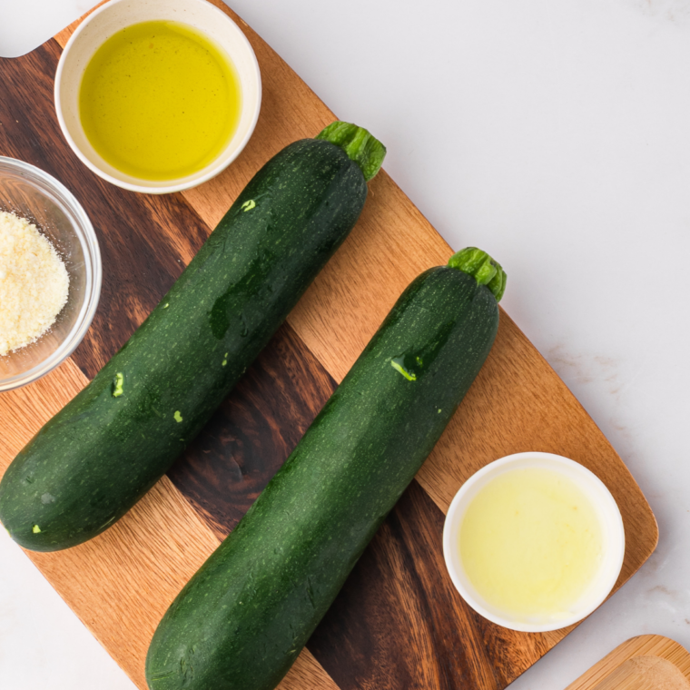 Ingredients needed for Crispy Air Fryer Zucchini Slices Without Flour (Naturally Low-Carb) on kitchen table.