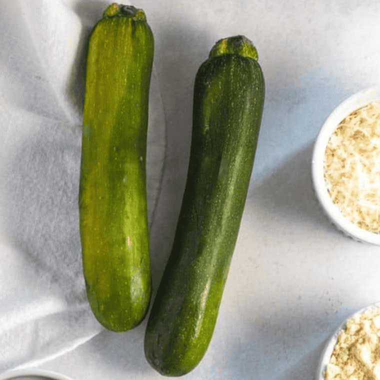 Ingredients needed for Easy Air Fryer Zucchini Noodles Recipe on kitchen table.