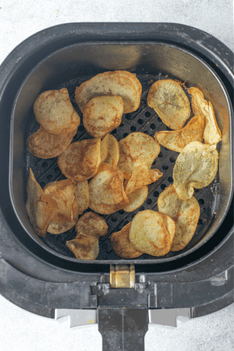 Cooked Easy Homemade Lay&rsquo;s Potato Chips Recipe in the air fryer basket.