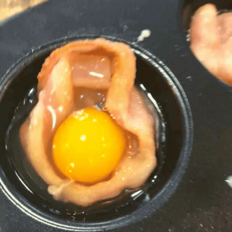 Bacon baskets in a muffin tin cooking in the air fryer at 400 degrees F