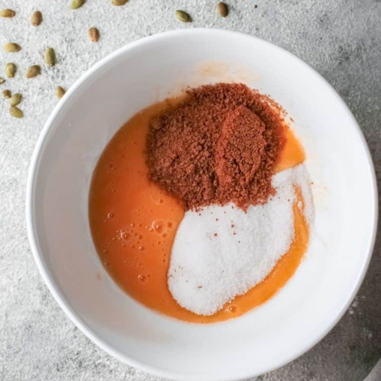 Brown sugar, granulated sugar, and pumpkin pie spice added to the wet ingredients