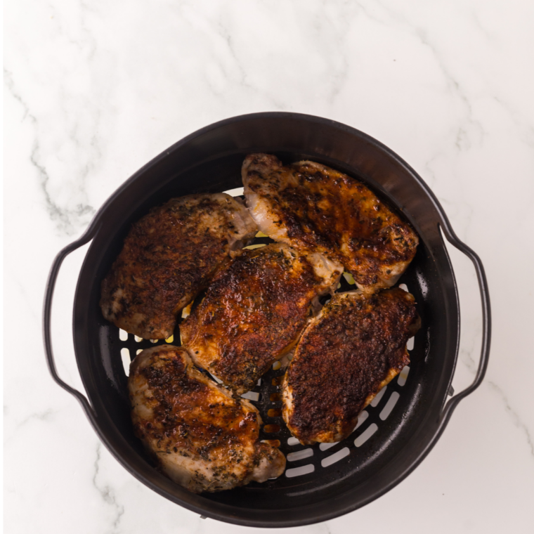 Honey garlic pork chops resting on a plate before serving