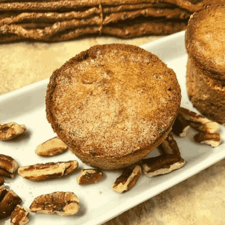 Golden, fluffy air fryer pecan pie muffins topped with chopped pecans