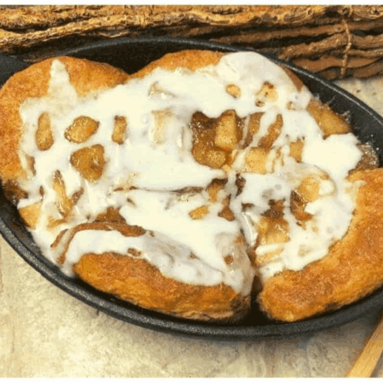 Air fryer skillet apple pie biscuit bites, golden, soft, and filled with cinnamon-spiced apples