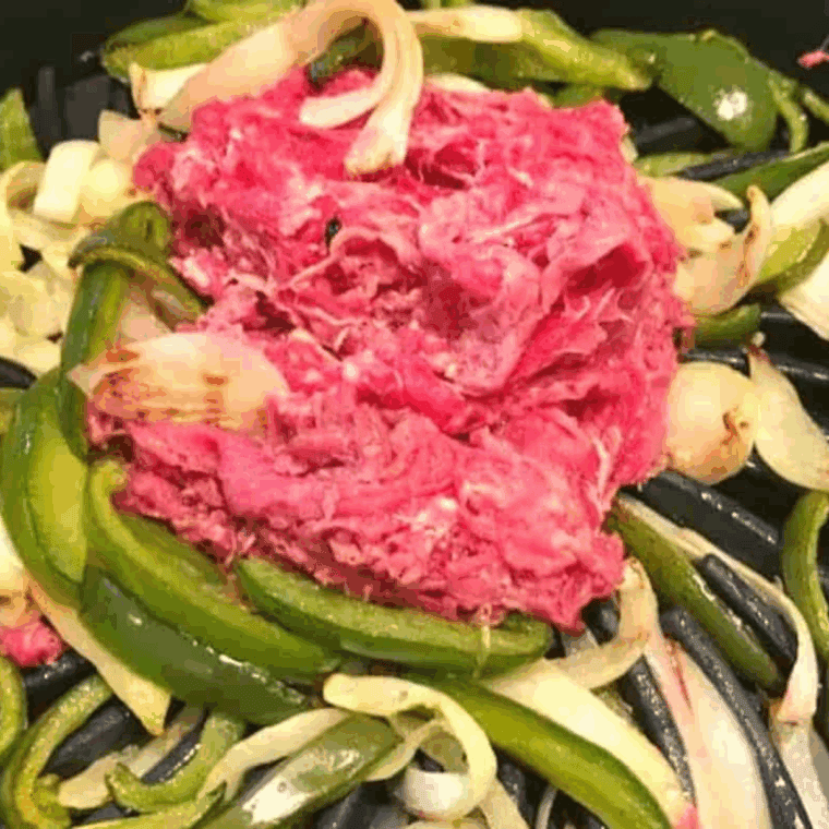 Saute the peppers, onions and meat.