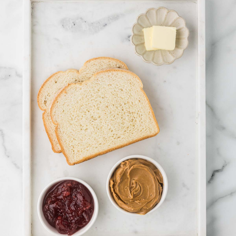 Ingredients for jam stuffed French toast: bread, strawberry
jam, egg, milk, vanilla, and sugar