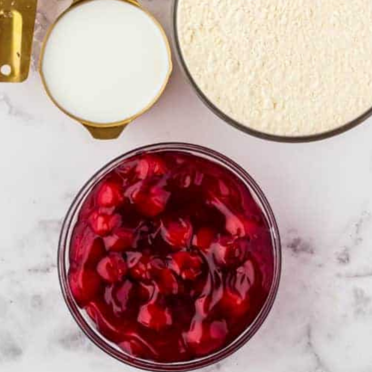 Ingredients needed for Air Fryer Cherry Crisp on kitchen table.