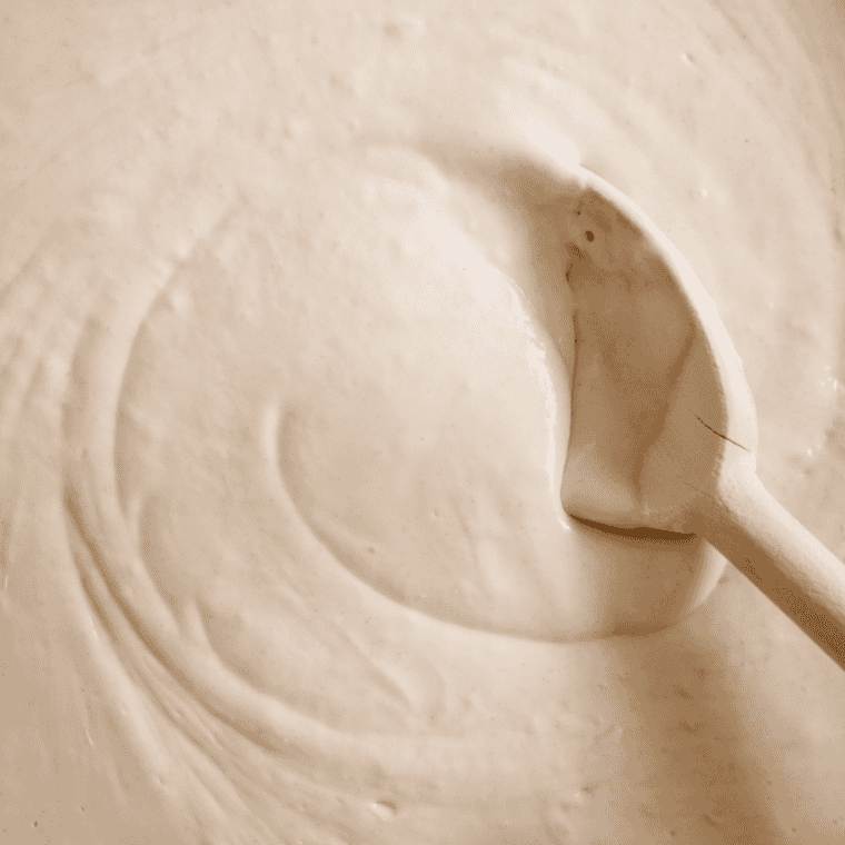 Mixing flour baking powder salt with butter sugar egg vanilla milk in small bowl