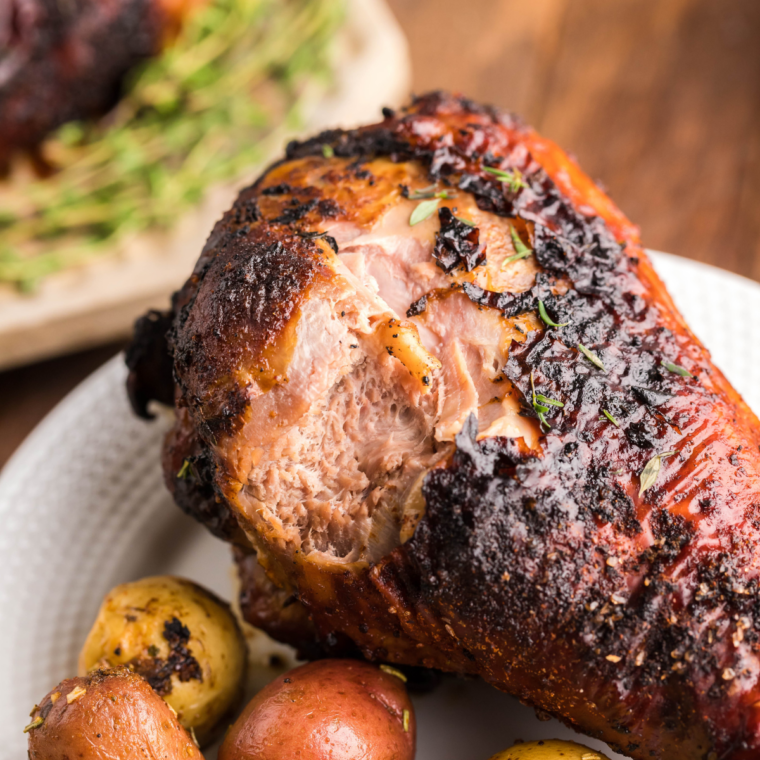 Golden brown air fryer turkey leg with crispy, spice-crusted skin