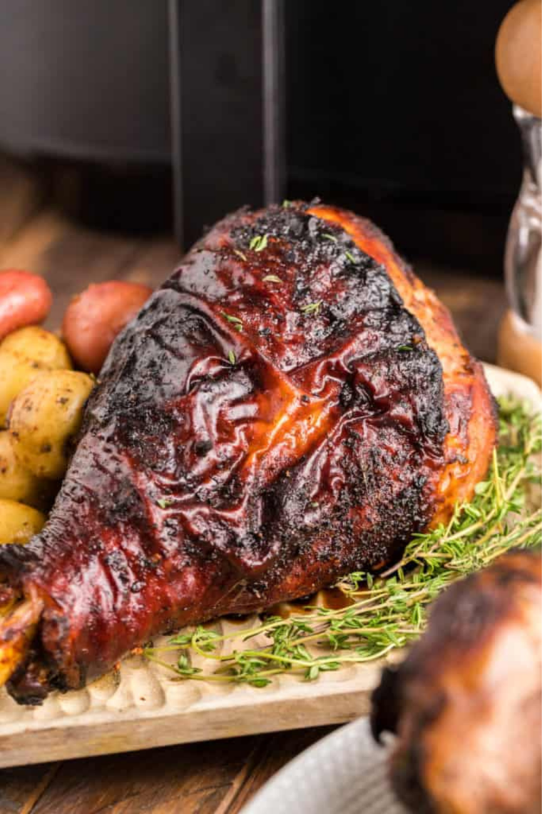 Cajun turkey legs served with roasted vegetables