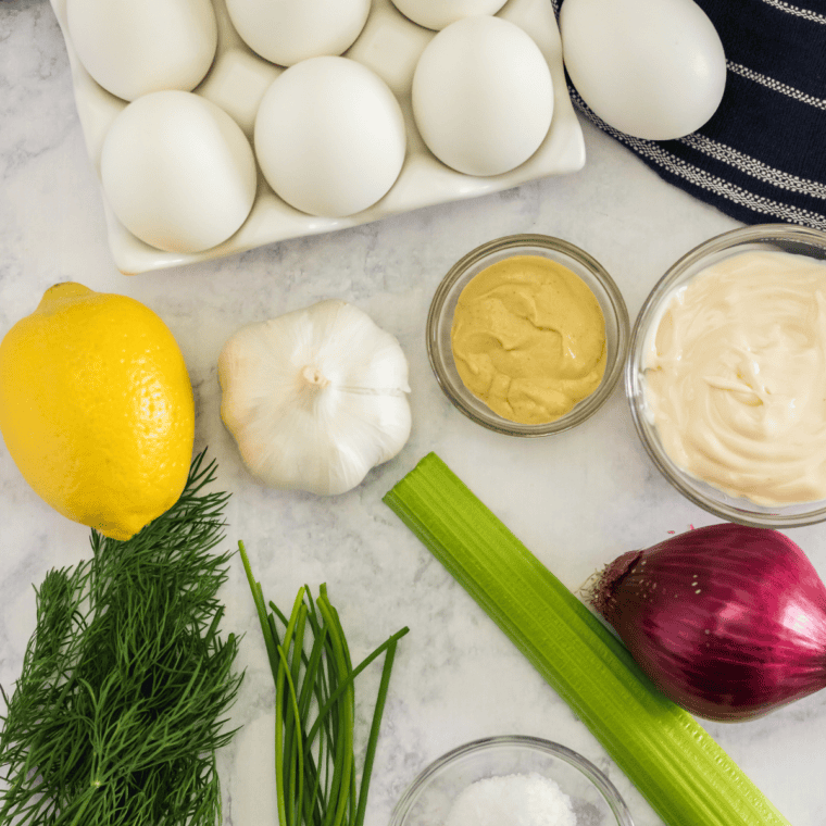 Ingredients needed for Barefoot Contessa Roasted Vegetable Frittata Recipe on kitchen table.