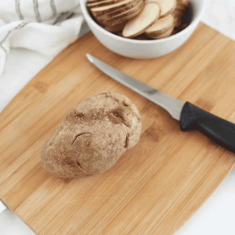 Thinly sliced potatoes for air fryer BBQ chips, cut with mandoline or knife