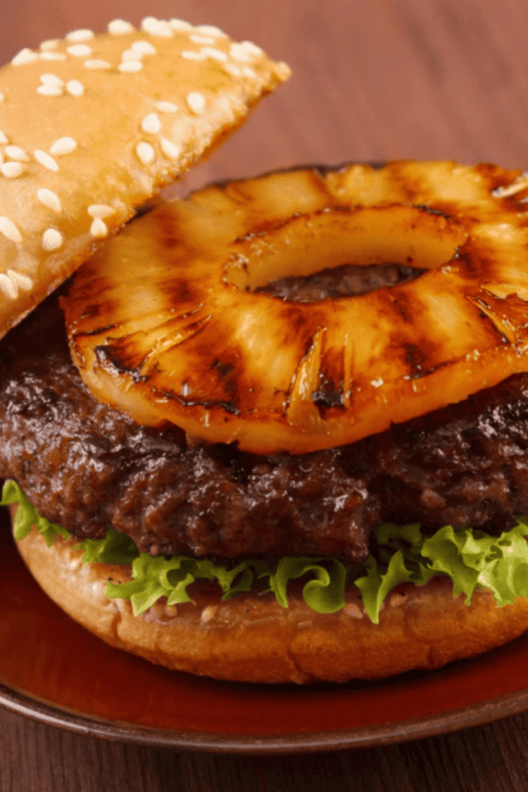 Air fryer pineapple rings coated with cinnamon and brown sugar, caramelized golden brown.