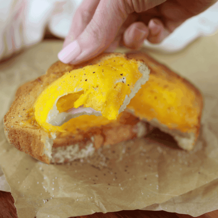 Crispy Air Fryer Egg Toast with a perfectly cooked sunny-side-up egg on top.