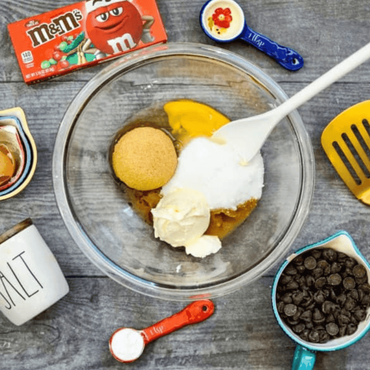 Ingredients needed for Easy Air Fryer M&M Cookies on kitchen table.