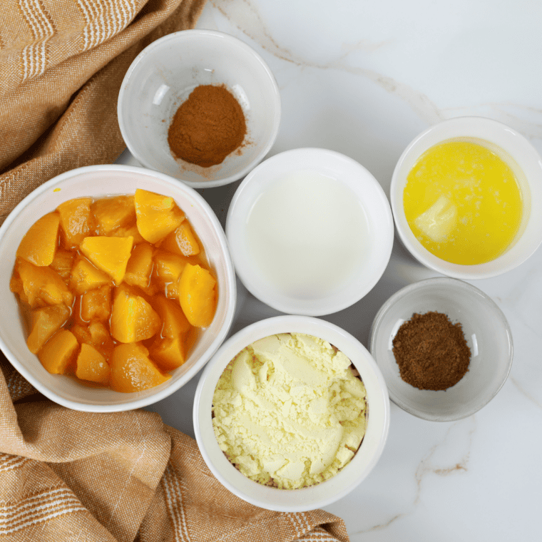 Ingredients needed for Easy Gluten-Free Air Fryer Peach Cobbler on kitchen table.