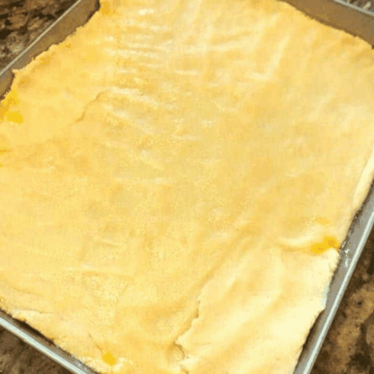 Add the dough to the bottom of the baking pan.