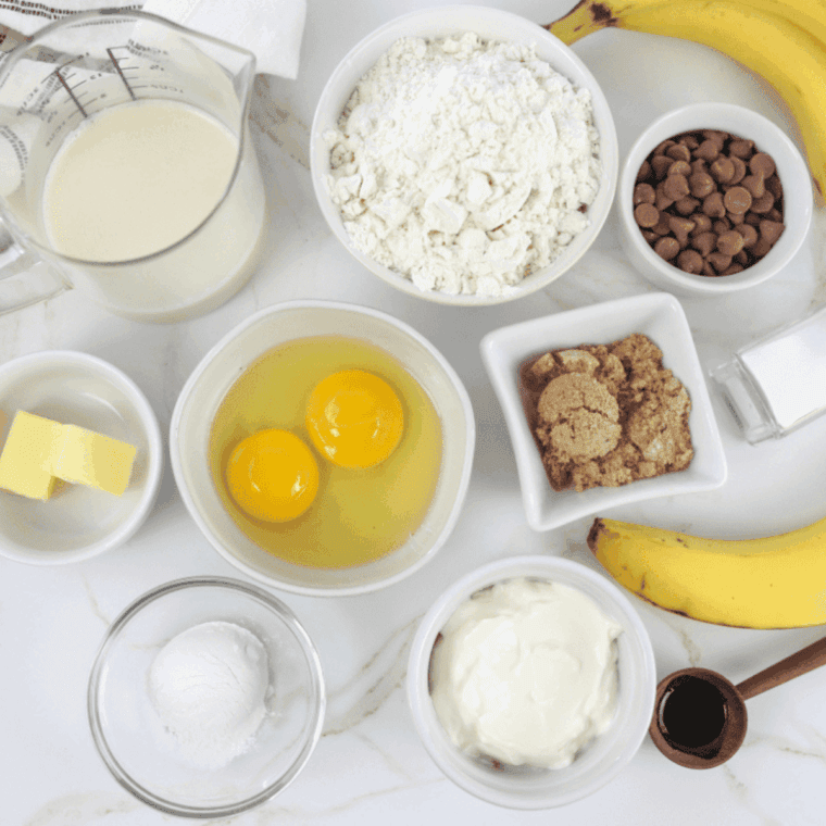 Ingredients needed for Air Fryer Biscuit Strawberry Shortcake on kitchen table.