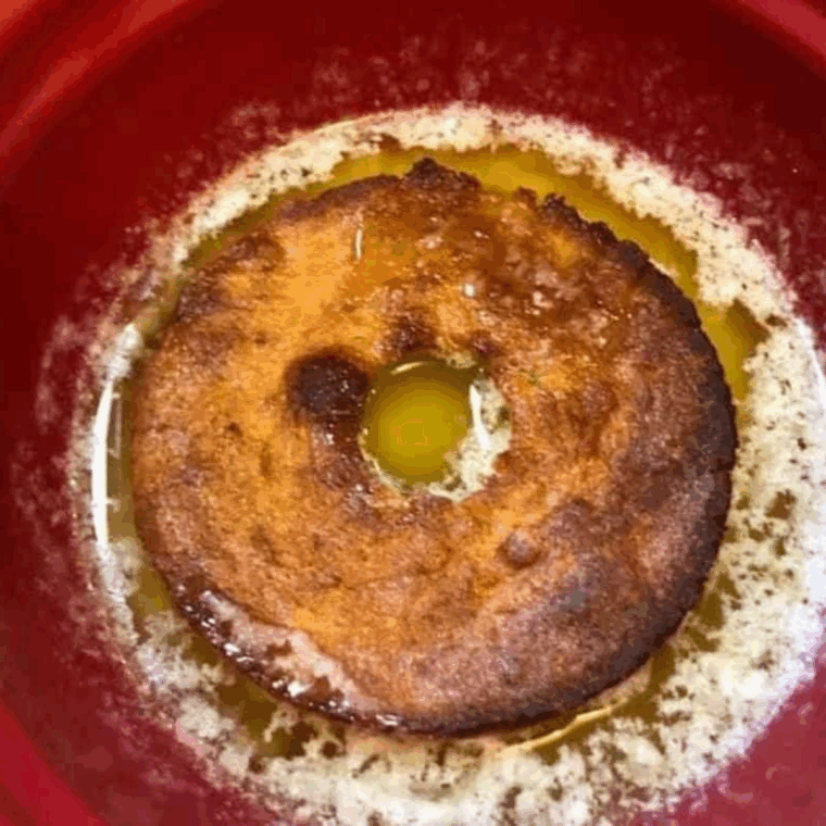 Air-fried banana donuts resting before being coated in melted butter and cinnamon sugar.