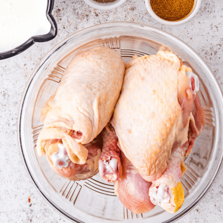 Ingredients for air fryer French's crunchy onion chicken laid out: chicken breasts, crispy fried onions, eggs, flour