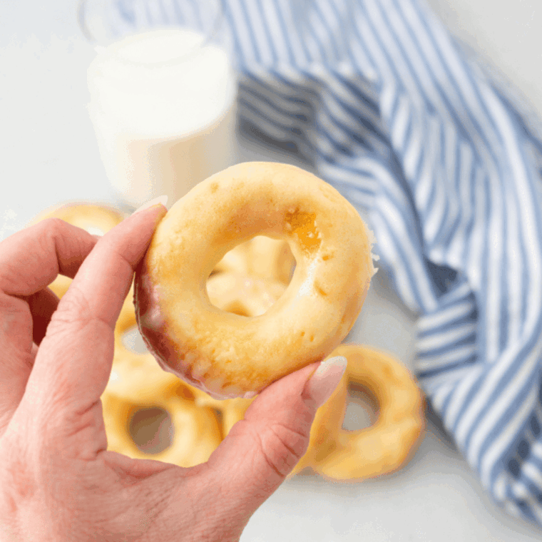 Freshly baked Dunkin Donuts copycat glazed donuts on a plate.