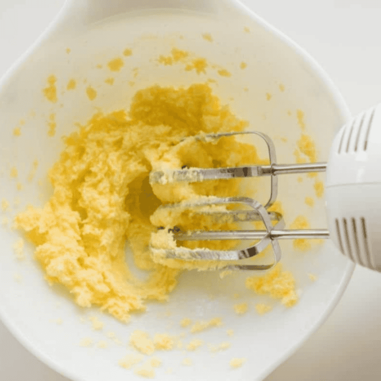 Creaming softened butter and sugar in a large bowl until light and fluffy.