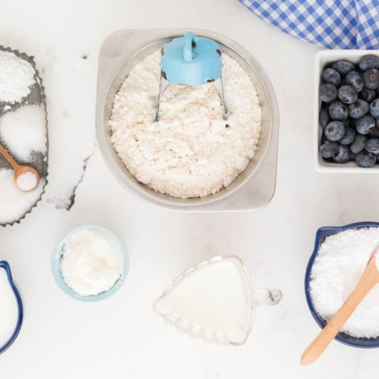 Whisking flour, sugar, baking powder, and salt in a large mixing bowl