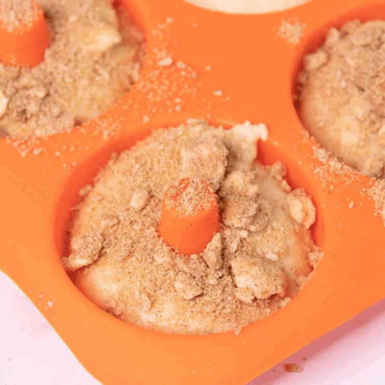 Add the topping onto the donuts.