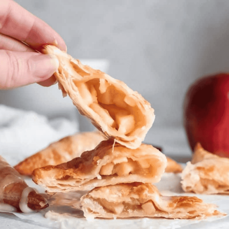 Crispy golden air fryer McDonald's apple pies spaced in a single layer in the air fryer basket