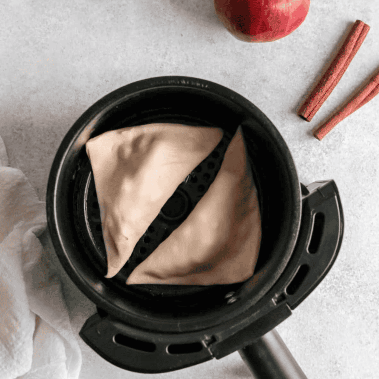 Air fryer copycat McDonald's apple pies brushed with egg wash and cinnamon sugar before air frying at 360°F