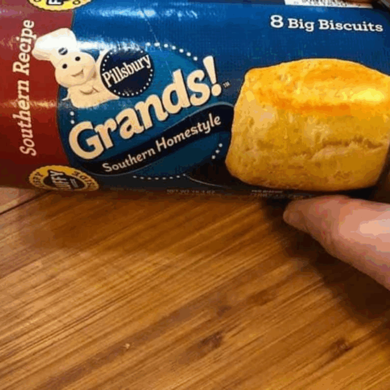 Ingredients needed for Easy Air Fryer Biscuit Donut Holes on kitchen cutting board.
