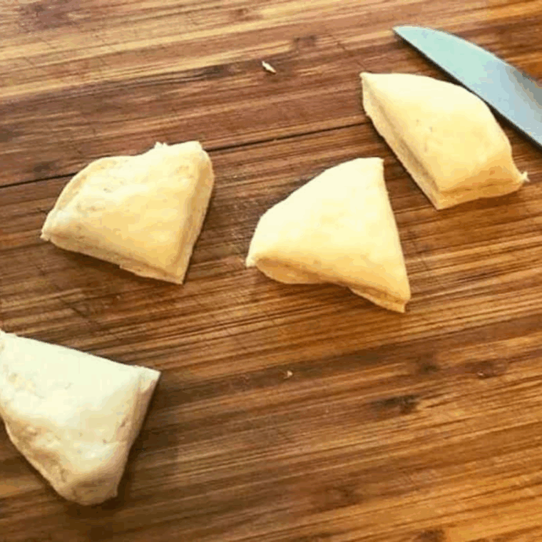 Cut the biscuit dough into pieces.