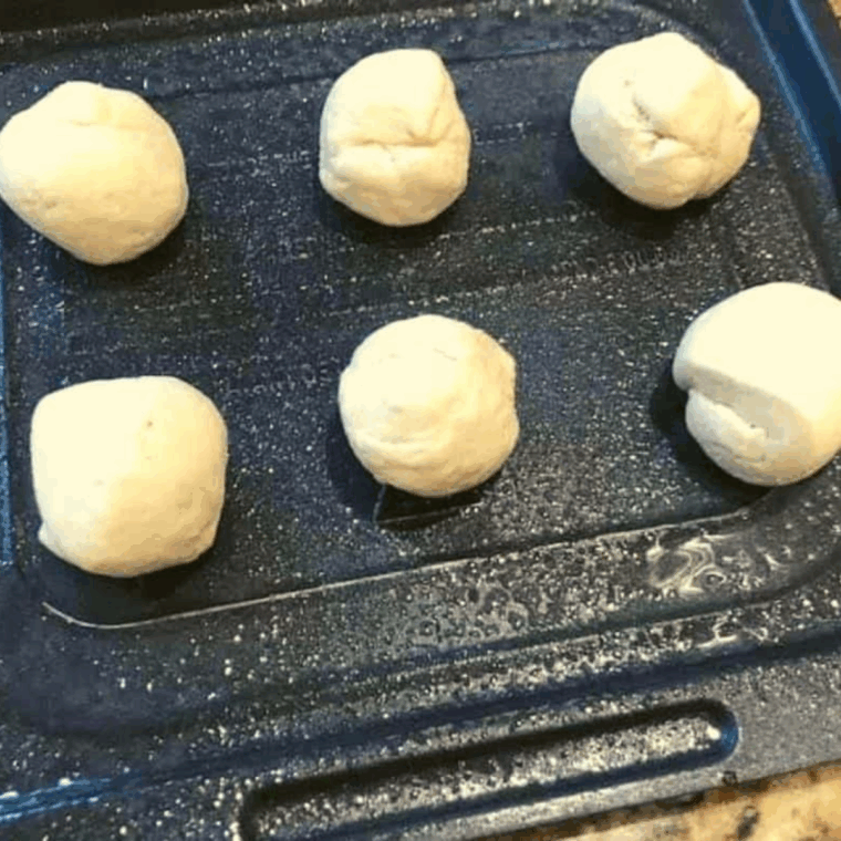 Roll the donuts into balls.