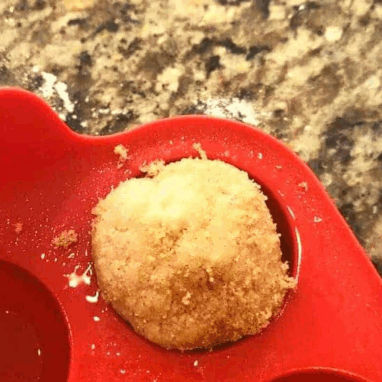 Place the dough into the donut pan.