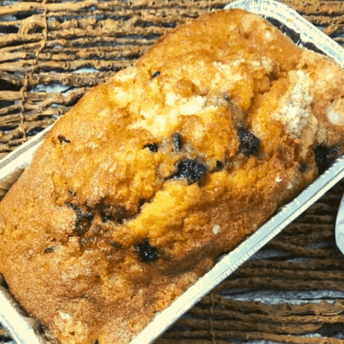 Freshly baked Air Fryer Lemon Blueberry Bread with golden crust and juicy blueberries