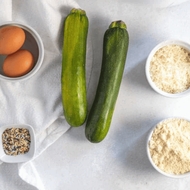Ingredients needed for Air Fryer Zucchini Pumpkin Quick Bread on kitchen table.