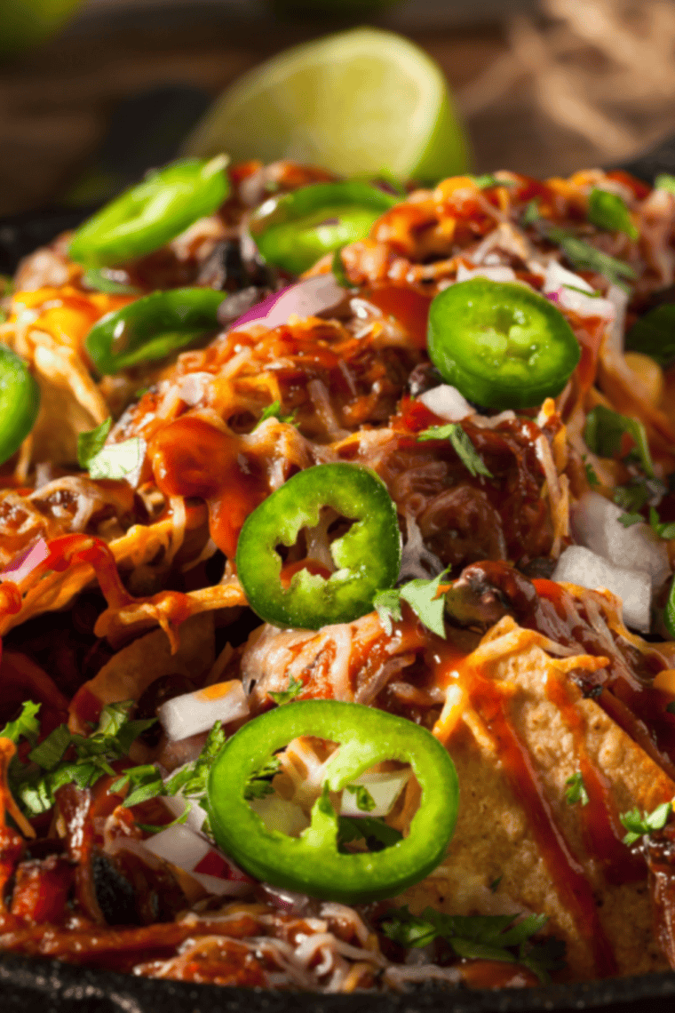 BBQ pork nachos FAQ guide with tips on pulled pork, tortilla chips, cheese, make-ahead prep, air fryer cooking, and spice level adjustments for loaded nachos.