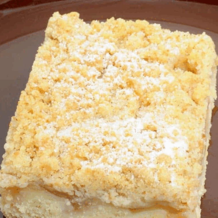 Slice of Air Fryer Apple Streusel Quick Bread with cinnamon topping on a plate.
Select 86 more words to run Humanizer.