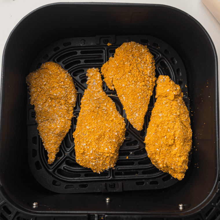 Chicken breast coated in mayonnaise in a resealable bag to help the panko breading stick