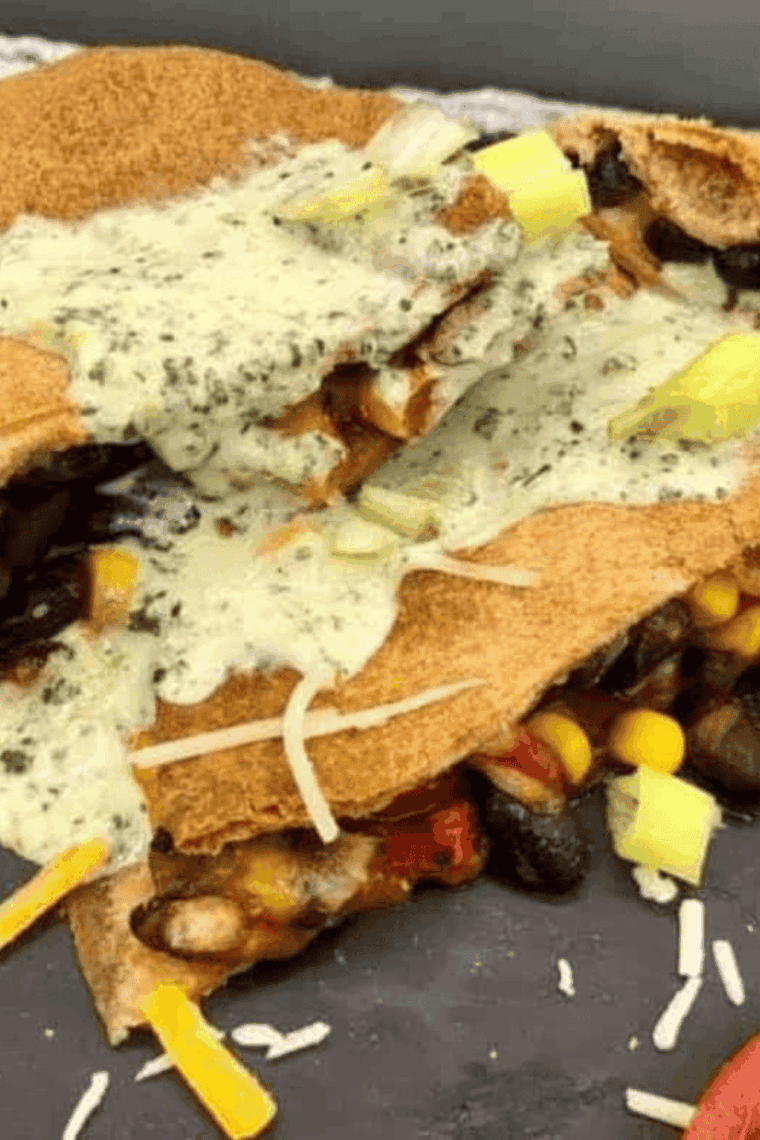 Air fryer black bean and corn quesadilla with melted cheese and crispy golden edges